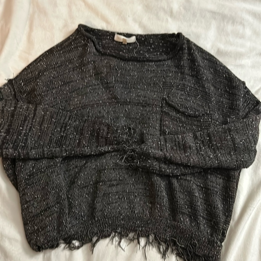 A cute over sized sweater with fringes